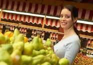 woman shopping for pears