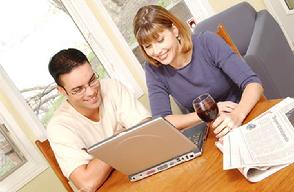 Couple reading news on Internet